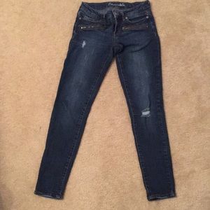 Dark wash, a bit distressed, ankle length jeans
